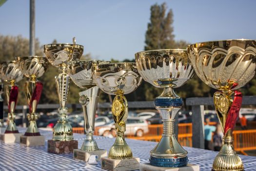 A set of cups or trophies ready to be delivered to the winners of the race