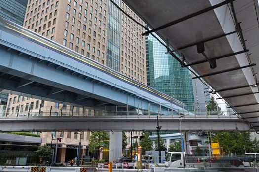 Modern architecture. Day view on modern Elevated Highways and steel and glass skyscrapers. Minato City, Tokyo.