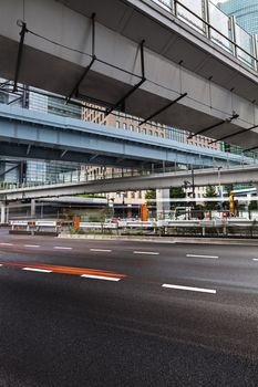 Modern architecture. Day view on modern Elevated Highways and steel and glass skyscrapers. Minato City, Tokyo.