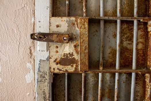 vintage old door with a lock and lots of rust