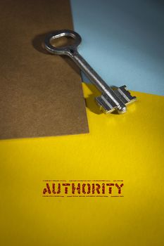 The poster with a key on Authority