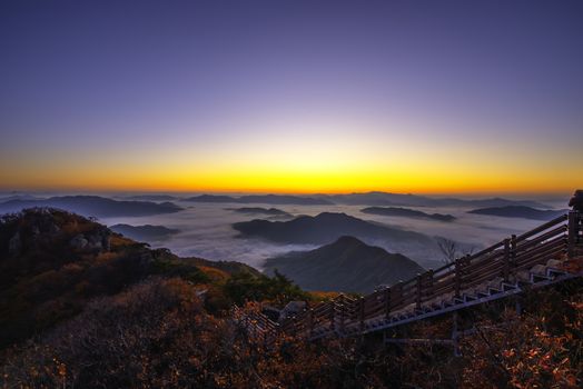 Morning mist in autumn on the peak of Cheonmasan mountain in Seoul, South Korea