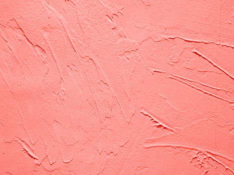 Vintage or grungy background of cement texture in Living Coral color of Year 2019. Decorative plaster effect on wall in Living Coral colour. It is a concept, conceptual or metaphor wall banner