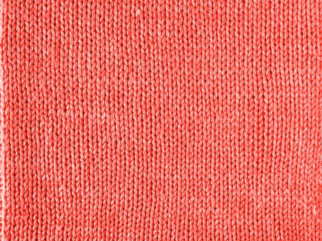 Living Coral color knitted Jersey as a textile background. Knitted Living Coral texture. Color of the year 2019 concept.