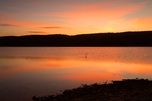 Beautiful rich red sunset across the Blue Mountains and lakes with reflections