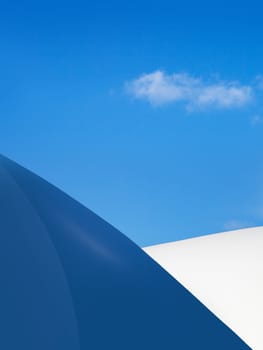 Modern fragment on a construction building, against blue sky, Sunny day