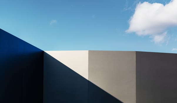 Modern fragment on a construction building, against blue sky, Sunny day