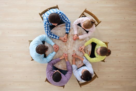 Startup diversity teamwork brainstorming meeting concept, people sitting around the table