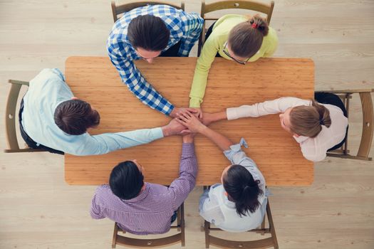 Business team stack hands, support concept, top view