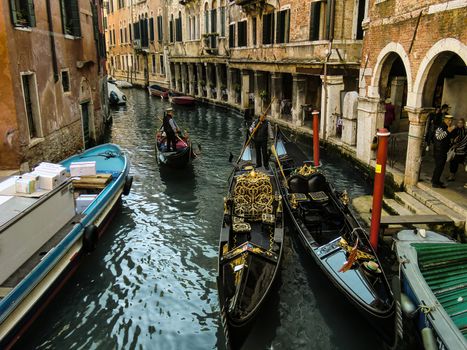 Clash between two Venetian gondolas in one of the most beautiful and characteristic canals of the whole city.