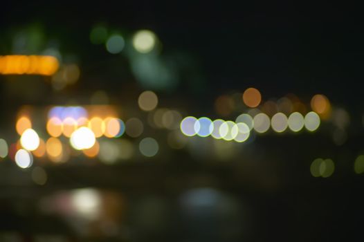 Background with bokeh lights in a city environment. Particularly suitable for graphic projects and backgrounds.