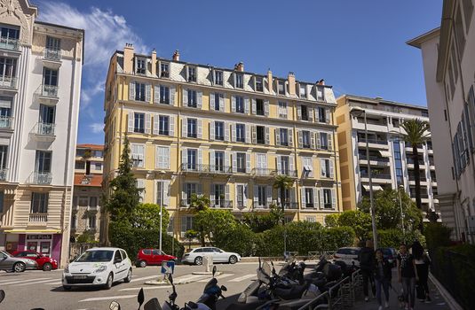 View of a colorful palace of Nice a city of unique and unmistakable architectural style: everyday life scene for the city.