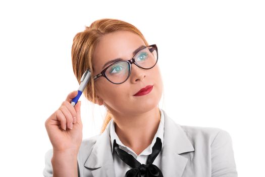 Portrait of a young beautiful businesswoman with glasses holding a pen and thinking, looking for a solution to a problem, isolated on white background.