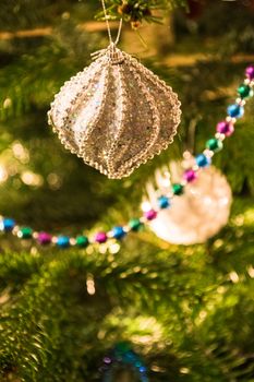 Closeup of Christmas-tree decorations shiny light