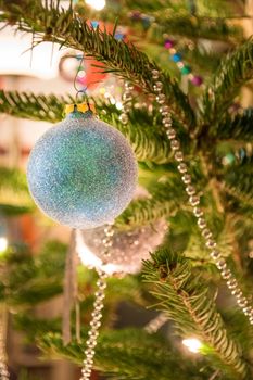 Closeup of Christmas-tree decorations shiny light