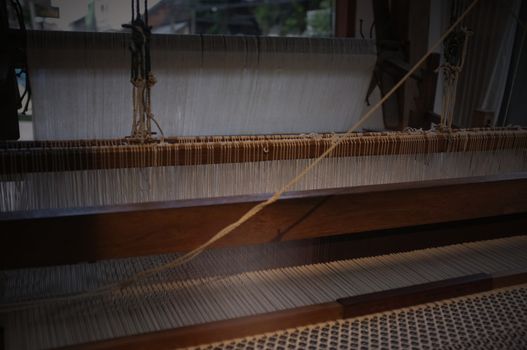 Close up Important tools used in weaving are called loom , Concept Weaving traditional thai fabric