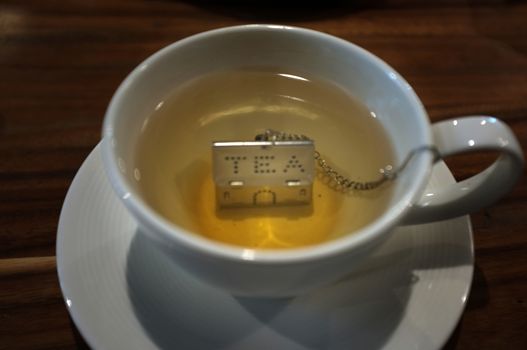 Cup of tea with House Shape Tea Strainers Stainless Steel Tea Infusers