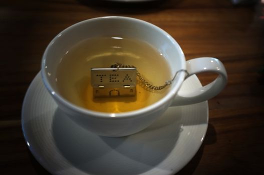 Cup of tea with House Shape Tea Strainers Stainless Steel Tea Infusers