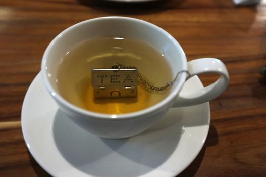 Cup of tea with House Shape Tea Strainers Stainless Steel Tea Infusers