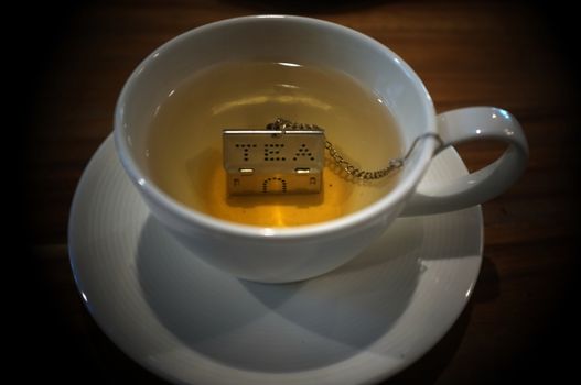 Cup of tea with House Shape Tea Strainers Stainless Steel Tea Infusers