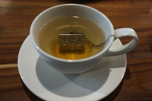 Cup of tea with House Shape Tea Strainers Stainless Steel Tea Infusers