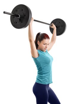 Beautiful young girl holding up a barbell, isolated on white background.