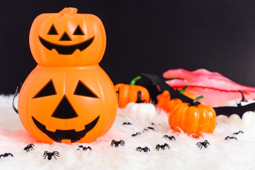 Pumpkin Jack creepy, spider and bat in photo, Halloween day concept on black background