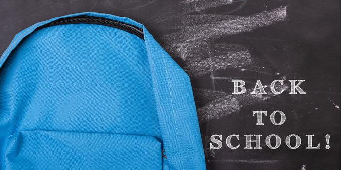 Back to school shopping backpack, The Accessories in student blue bag on blackboard background and have chalkboard also