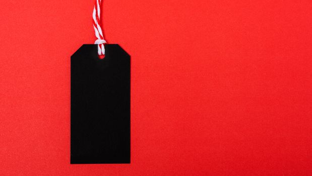 Promotion blank black tag label on red background