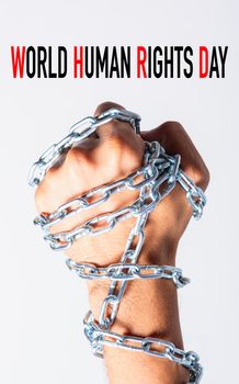 Chained fist hands with WORLD HUMAN RIGHTS DAY text on white background, Human rights day concept