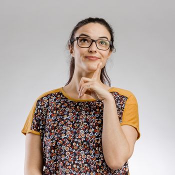 Funny portrait of woman thinking on something