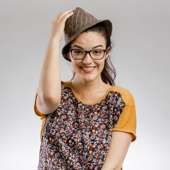 Portrait of a happy woman wearing a hat and smilling