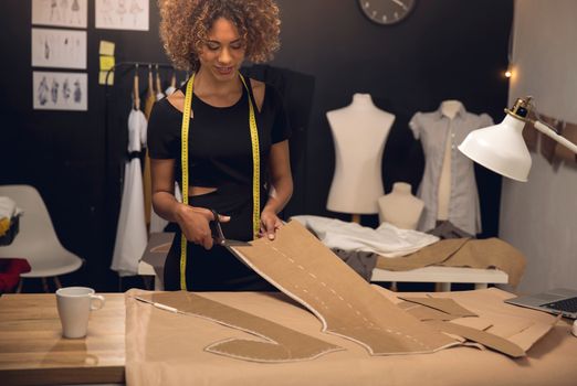 A young fashion designer working on her atelier