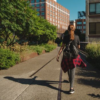 Beautiful woman walking on the HighLine Park, NYC