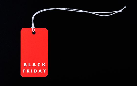 Online shopping, Promotion Black Friday text on red tag label on black background