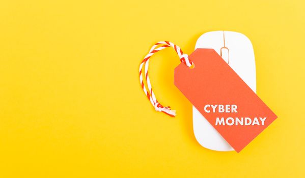 Internet online shopping marketing, Promotion Cyber Monday text on red tag label and white mouse with yellow background
