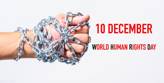 Chained fist hands with 10 DECEMBER WORLD HUMAN RIGHTS DAY text on white background, Human rights day concept