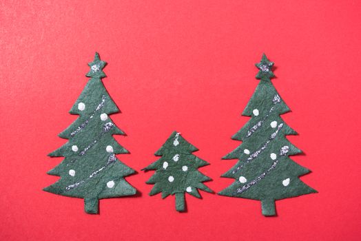 Christmas green tree on red background and have copy space for use