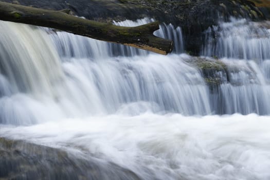 Beautiful view of Jedlove Falls in super green forest surroundings, Czech Republic