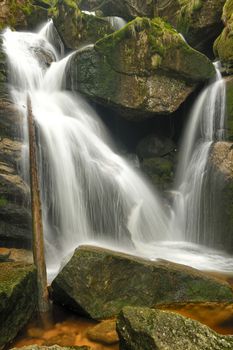 Beautiful view of Potoka Falls in super green forest surroundings, Czech Republic