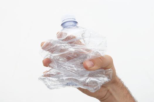 conceptual plastic free photo - the plastic bottle held in the hand