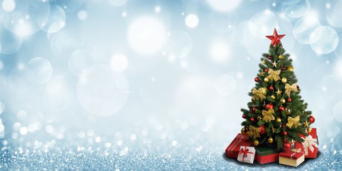 Decorative Christmas Tree over blue glitter background with copy space