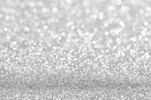 Shiny silver bokeh glitter lights abstract background, Christmas New Year party celebration concept