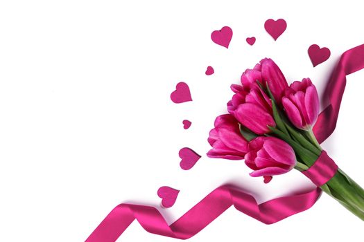 Pink tulips with ribbon and hearts isolated on white background Valentines day concept