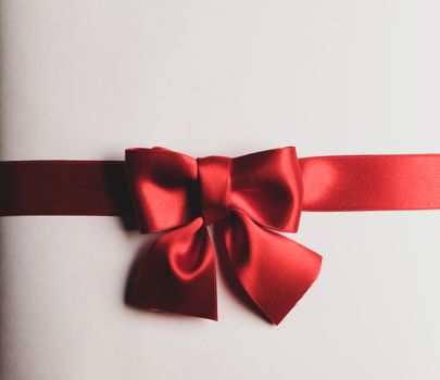 Red gift bow on white background holiday gift concept