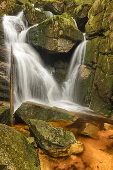 Beautiful view of Potoka Falls in super green forest surroundings, Czech Republic