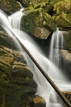 Beautiful view of Potoka Falls in super green forest surroundings, Czech Republic