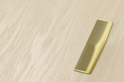 Gold hair comb on wood table