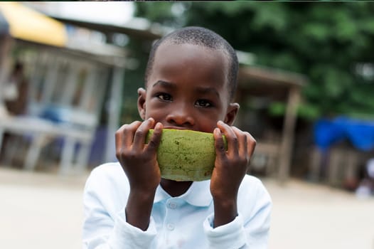 close-up of a young woman blowing bubbles in the bush.