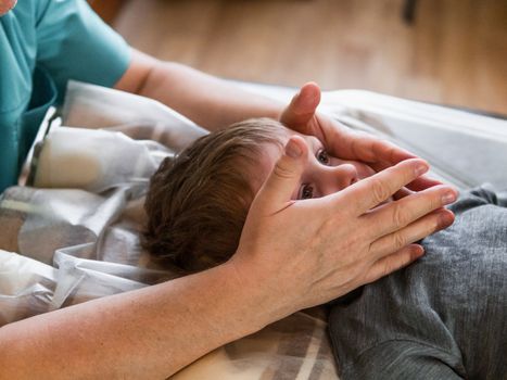 Real osteopath does physiological skull therapy for a child. Osteopathy Treatment.